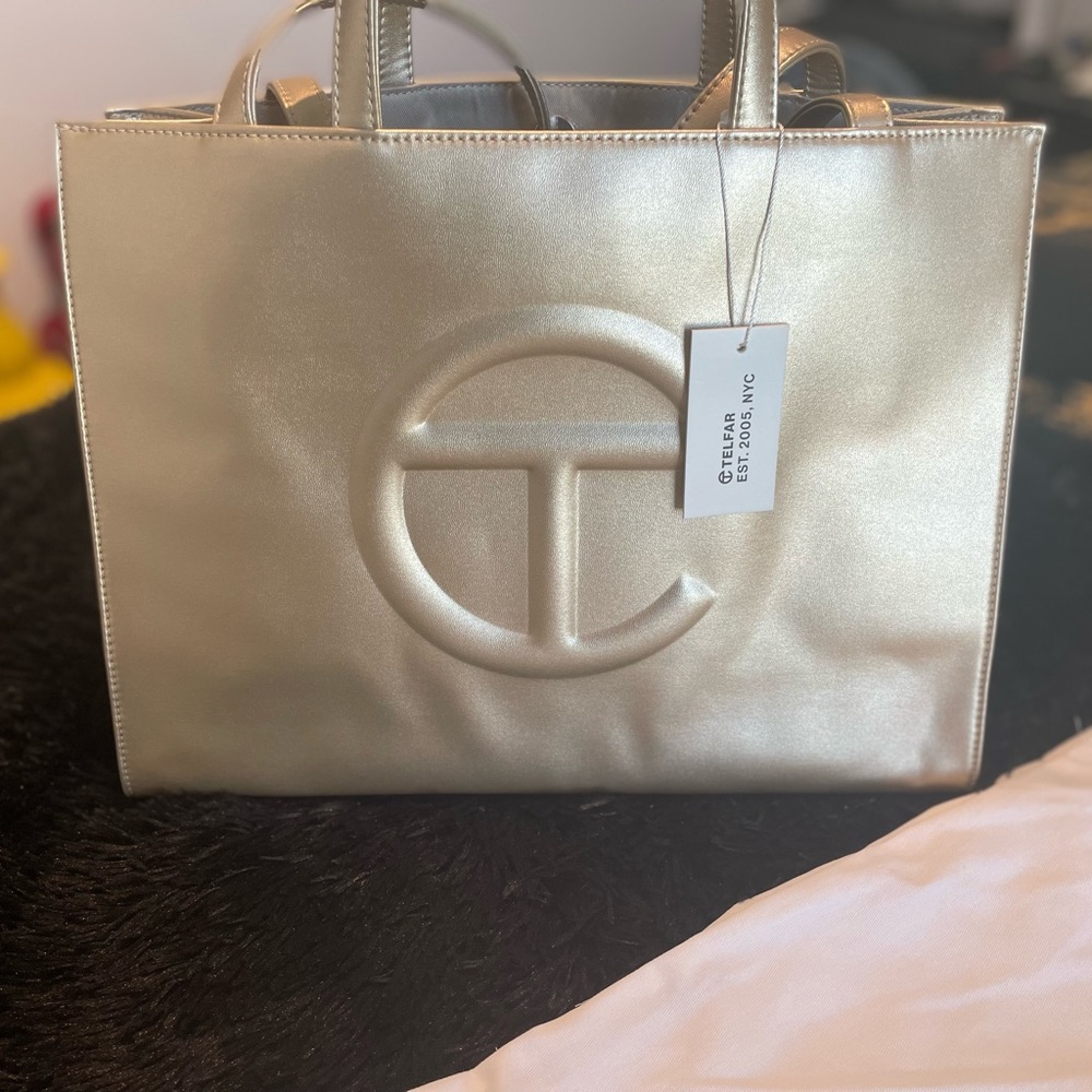 Brand new Gold medium Telfar shopping bag. Never worn. With original dust bag